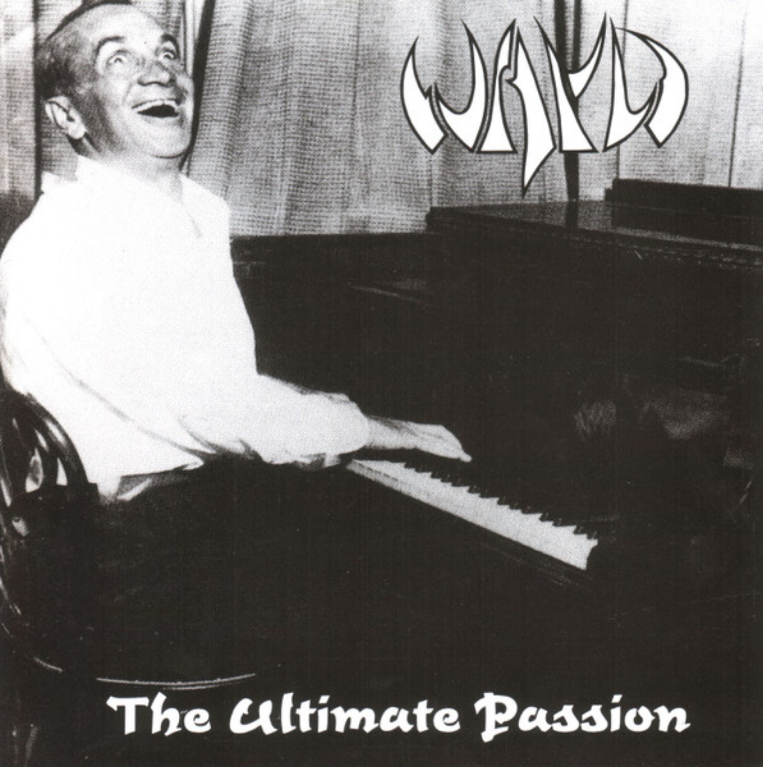 WAYD – The Ultimate Passion: black-and-white sleeve showing a laughing man at a piano.